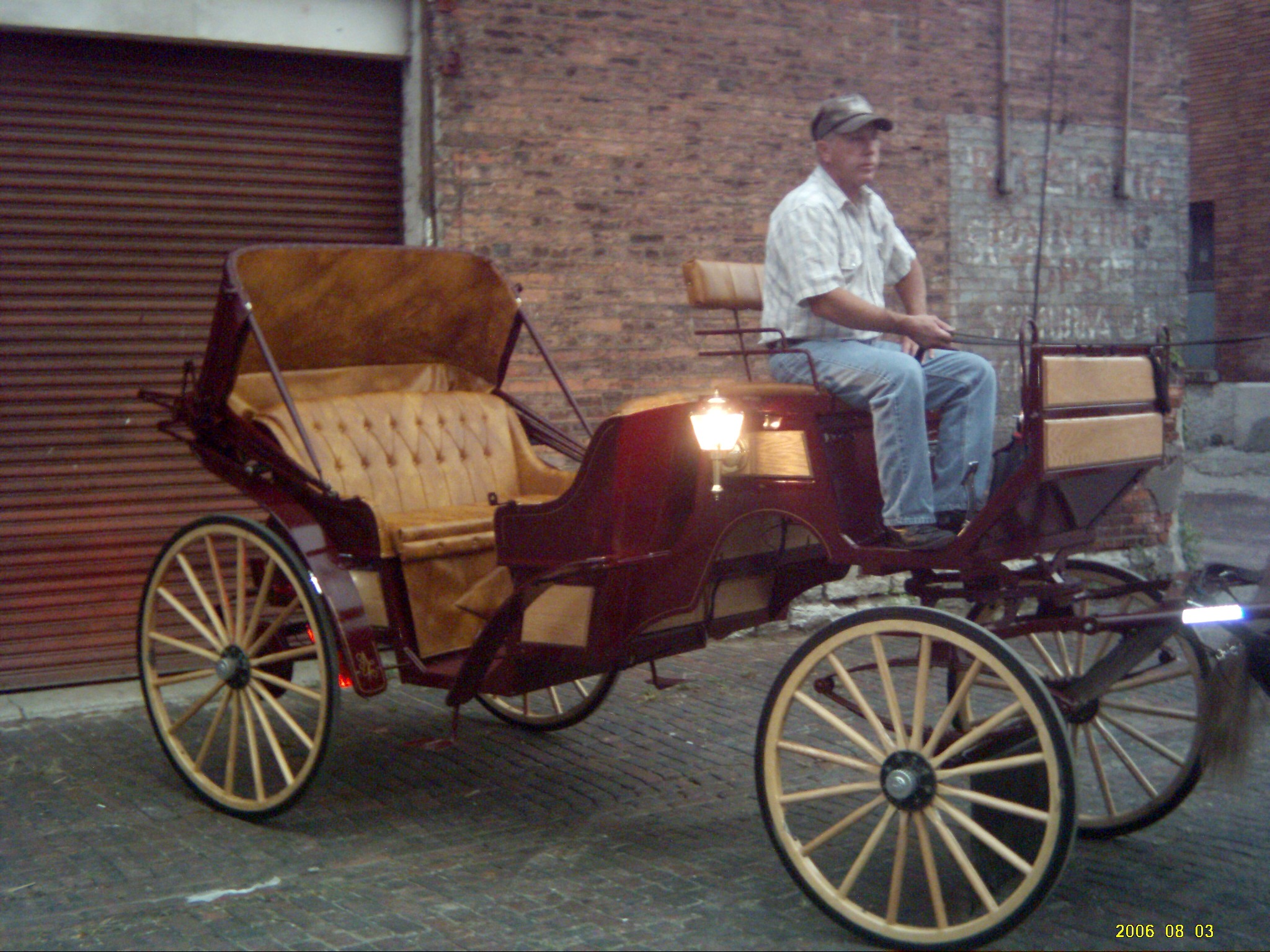 Stricking burgundy and tan wedding carriage used in Cincinnati Ohio - OH, Covington Kentucky - KY, Newport Kentucky - KY and surrounding areas