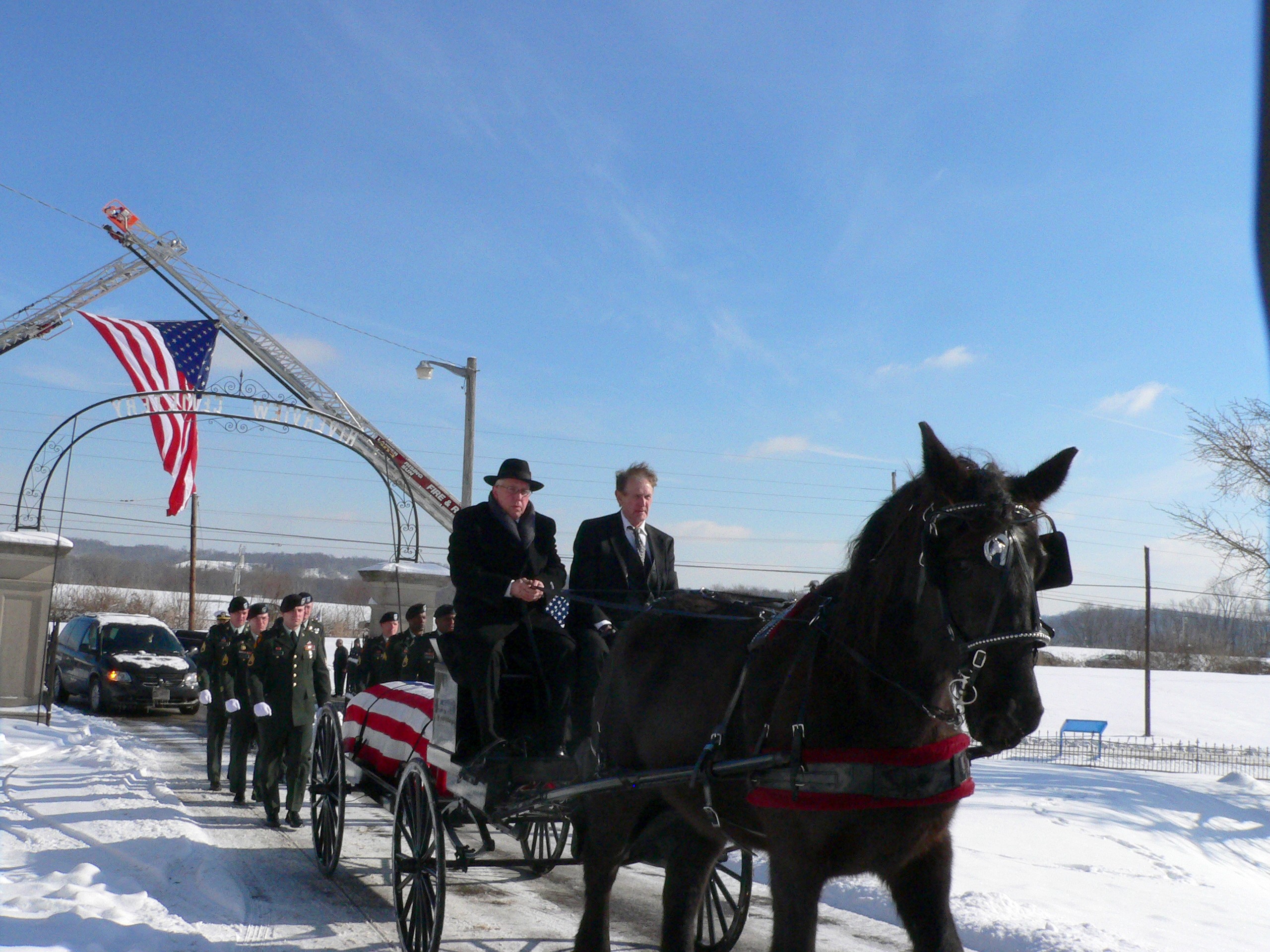 Dutchess taking a soldier to the cemetery in a Indiana Military Funeral